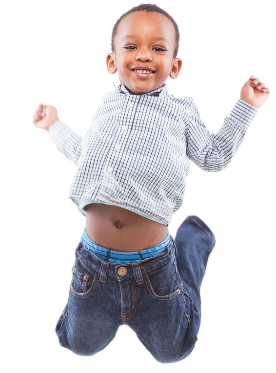an african american boy jumping in the air