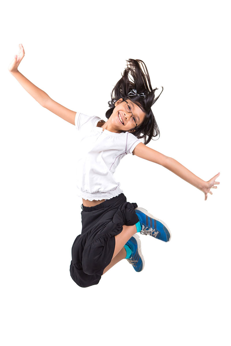 a girl jumping in the air