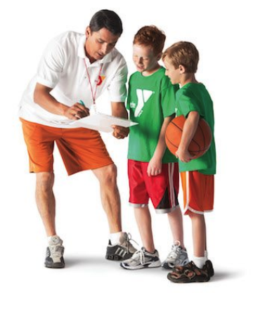 an adult coaching a boys youth basketball team.