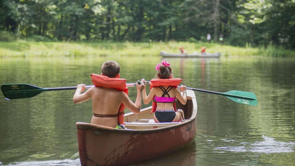 kids canoeing during summer