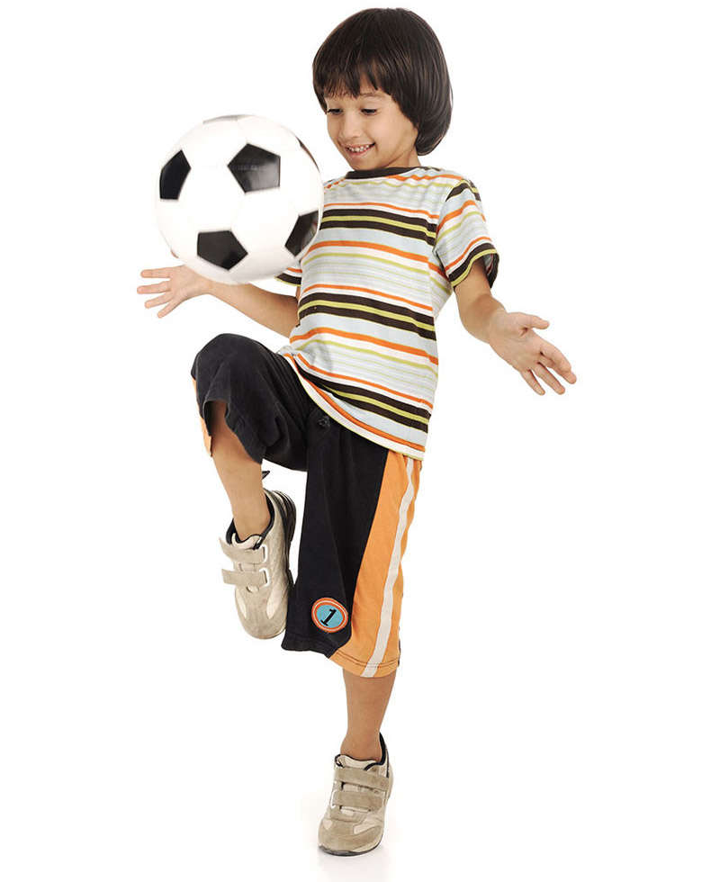 a child doing soccer tricks