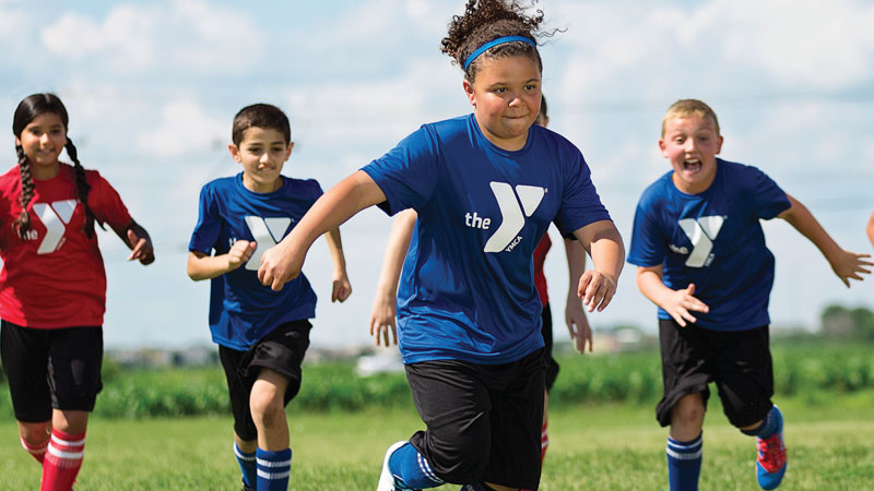 group of kids playing soccer