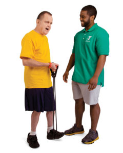Y staff member and blind person using stretch band