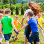 Group of kids singing summer camp songs